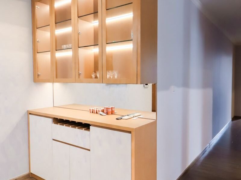 Wooden crockery unit with glass-fronted display doors