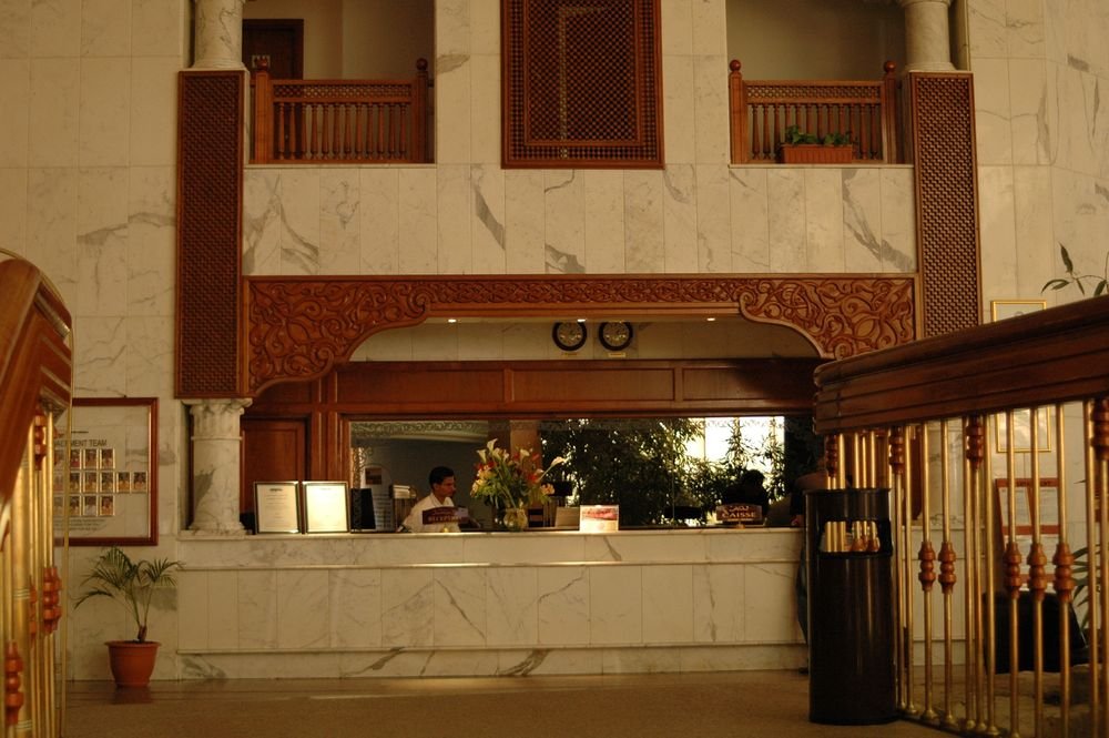 Hotel lobby finished with wood panelling and detailed ceiling woodwork