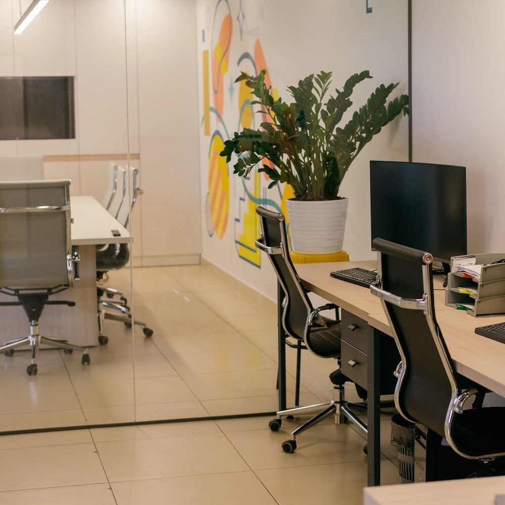 Corporate office fit-out with glass partitions and modular workstations in Ludhiana