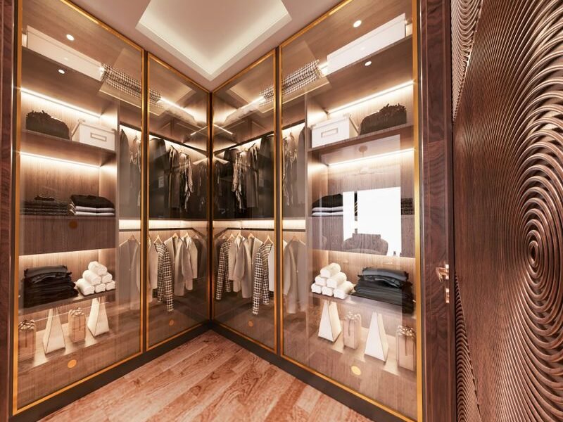Sliding-door wardrobe with glass fronts in a modern bedroom